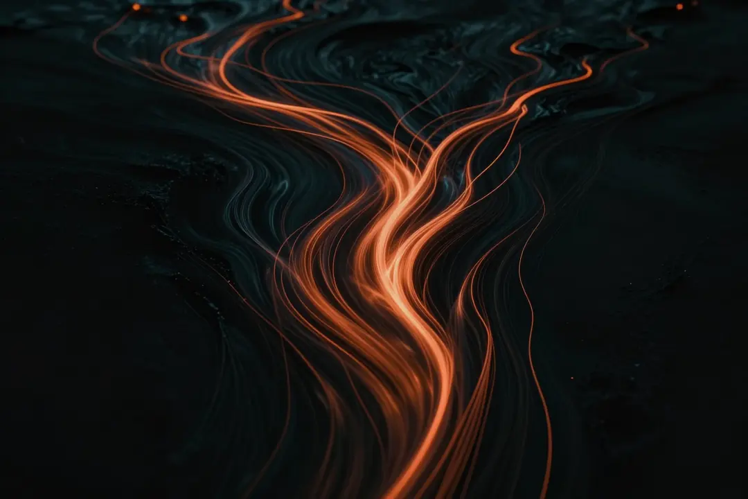 Streams of glowing amber light flowing and merging through darkness